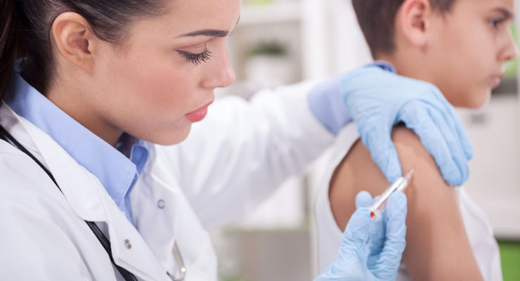 Adolescent male being vaccinated against HPV