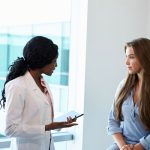 Doctor talking to a female patient