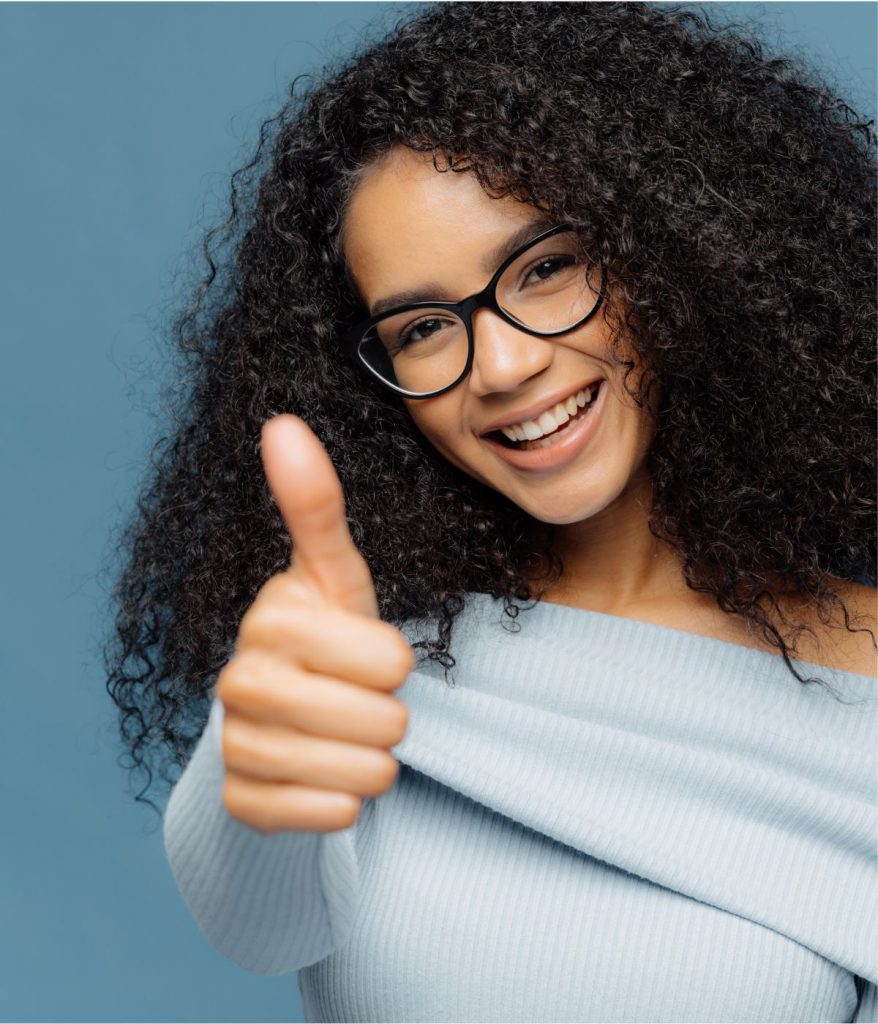 A teen gives a thumbs up