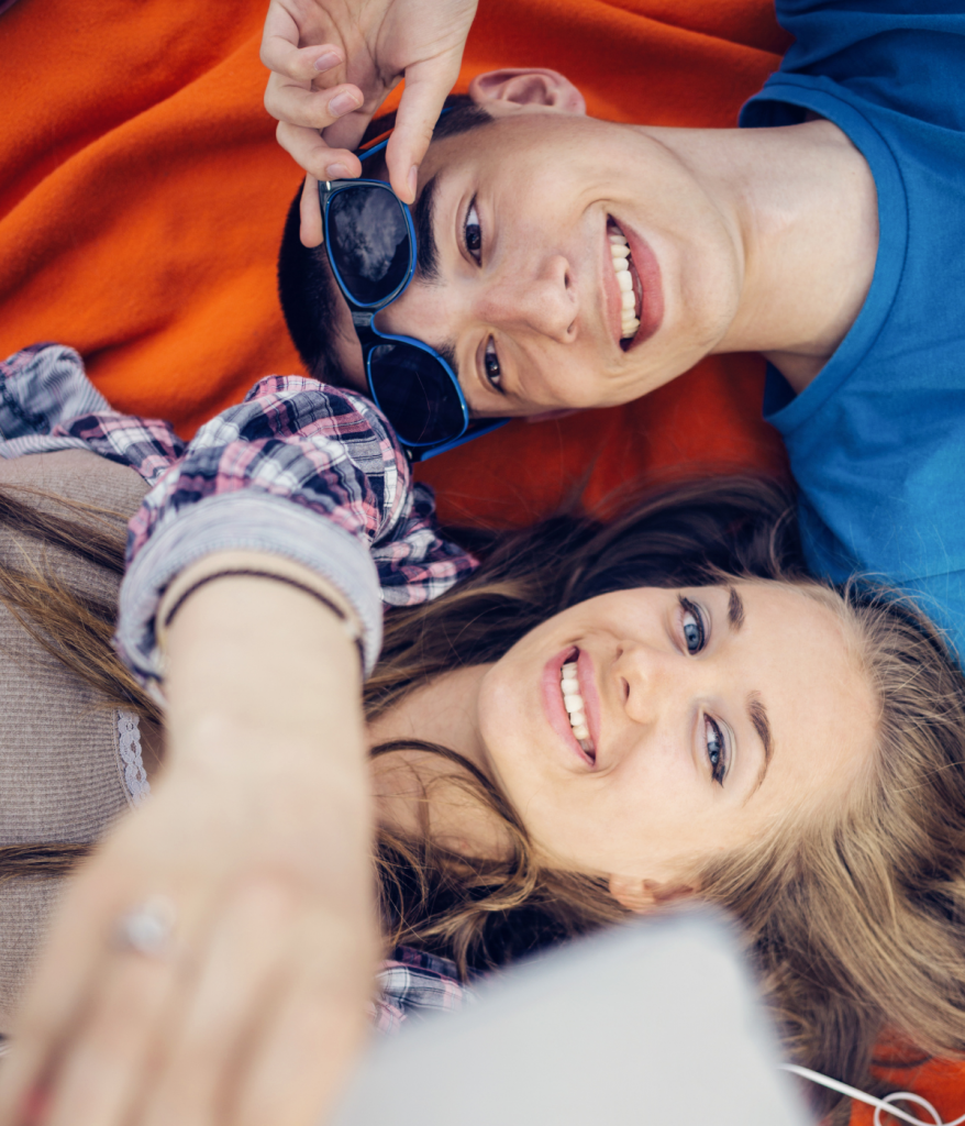 A young couple takes a selfie