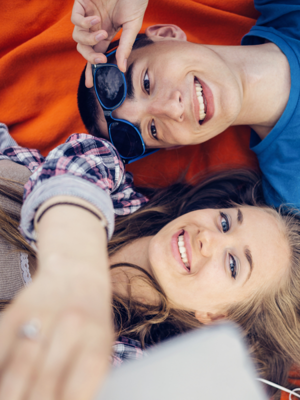 A young couple takes a selfie